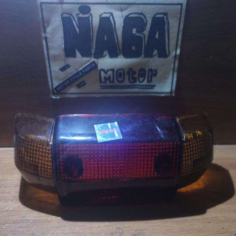 Mika Lampu Stop Belakang Plus Sen Alfa Champ Kualitas Original
