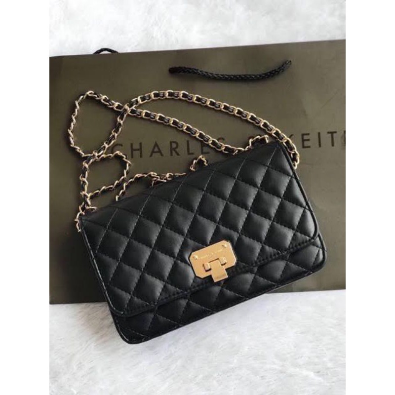 Bag branded Charles &  Keith with care card