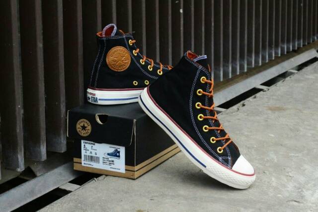 tan and black converse