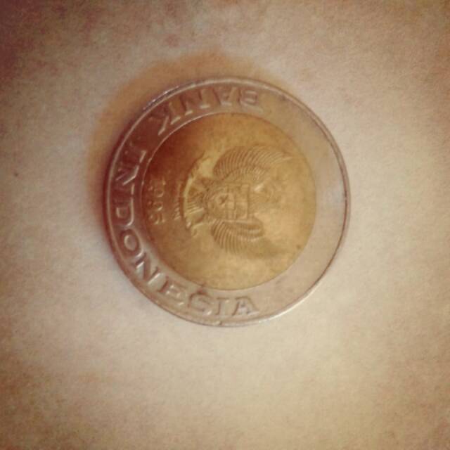 Uang kuno logam kelapa sawit.