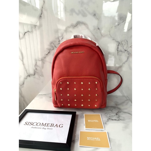 MK erin medium backpack leather flame