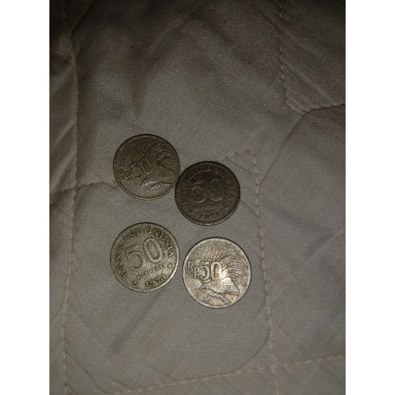 uang koin 50 rupiah burung kenari