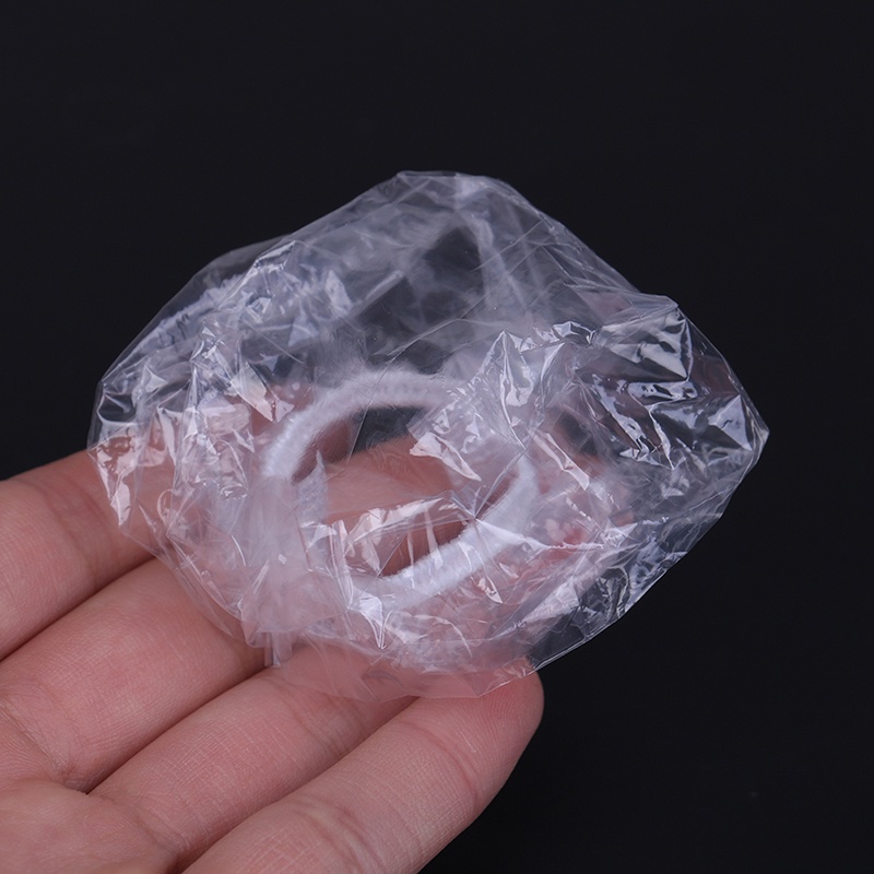 100pcs Penutup Telinga Bahan Plastik Anti Air Sekali Pakai