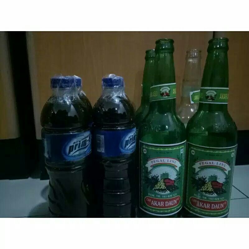 jamu pegal linu cap akar daun banyuwangi kemasan botol plastik