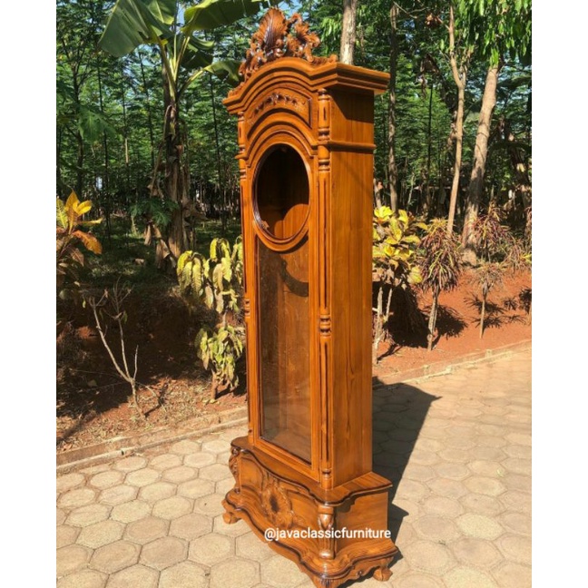 1 SET LEMARI JAM UKIR TIANG ULIR BAHAN KAYU JATI SUDAH DI LENGKAPI DENGAN JAM DAN KACA FINISHING NATURAL JEPARA-1