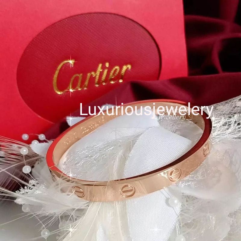 Gelang bangle tittanium ada grafir logo