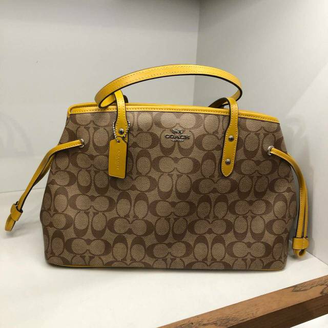 ready
coach drawstring carryall signature saddle list flax