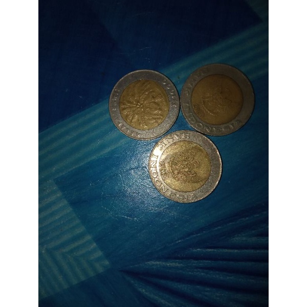 uang koin 1000 kelapa sawit