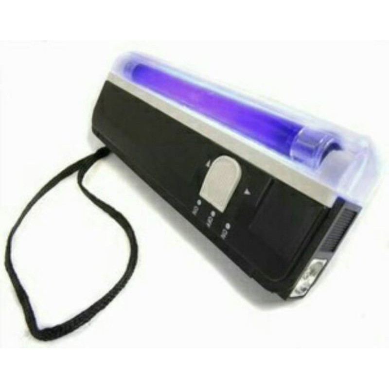 lampu untuk melihat uang palsu/asli
