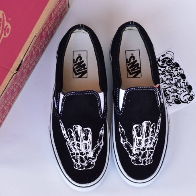 skeleton vans slip ons