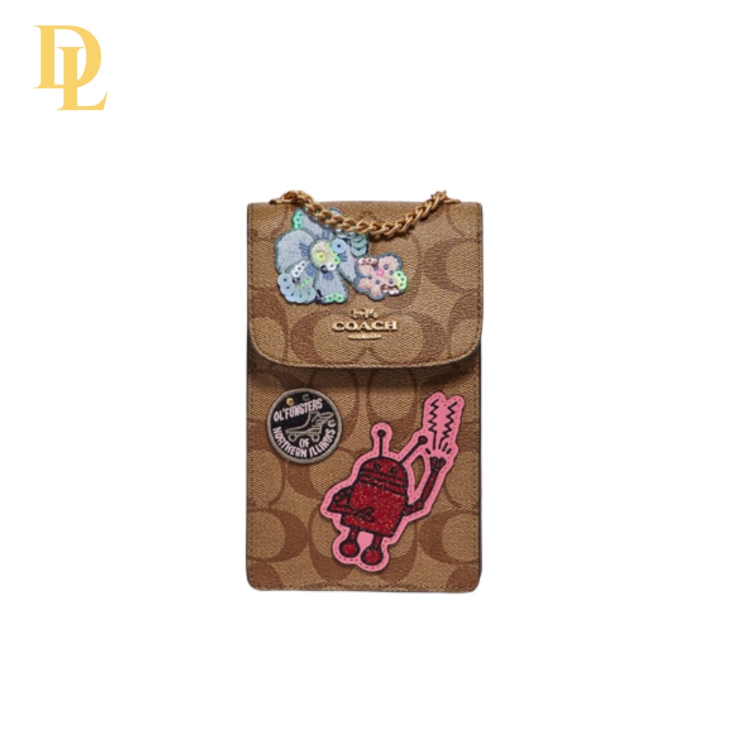 KEITH HARING NORTH/SOUTH PHONE CROSSBODY IN SIGNATURE CANVAS WITH PATCHES (COACH F39955)