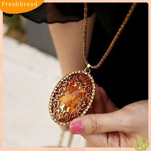 [TERLARIS]Women's Vintage Amber Tone Hollow Long Chain Drop Pendant Sweater Necklace