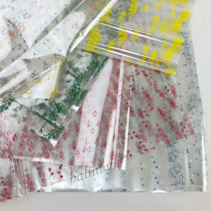 

PLASTIK PARSEL / KADO TRANSPARAN MOTIF UK. 95 X 75 CM ( 10 PCS )