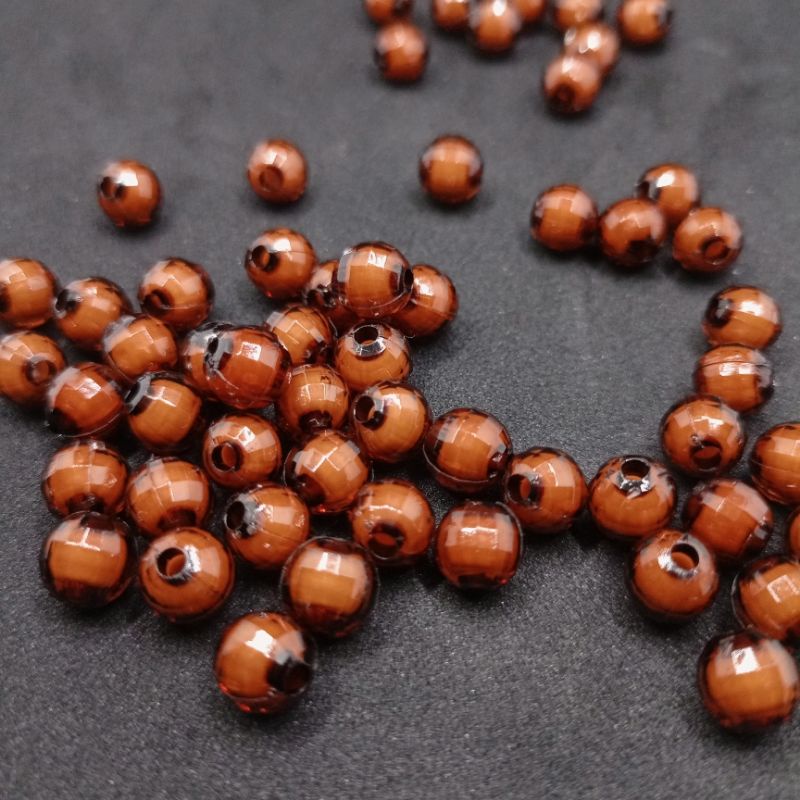 Manik Isi Bola Dunia Coklat