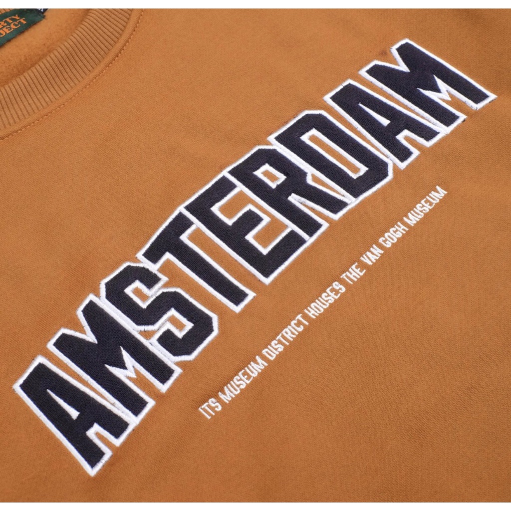 SWEETSHIRT AMSTERDAM CAMEL POLOS BORDIR LOGO DEPAN ORIGINAL