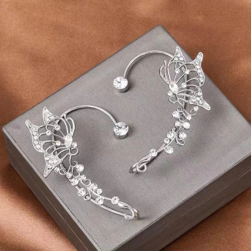 Anting Klip Desain Sayap Kupu-Kupu Hollow Hias Kristal Berlian Imitasi Gaya Korea Untuk Wanita
