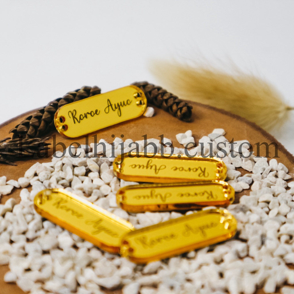 

label hijab | label baju | label akrilik | custom label | label jilbab | label cutting | label gold