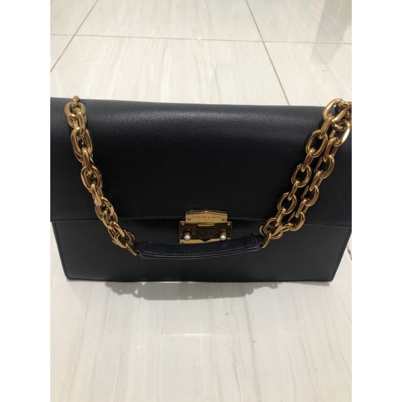 Sling bag original charles and Keith