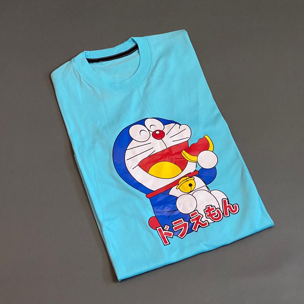 Kaos Baju Doraemon Makan Dorayaki Kartun Lucu Distro Motif TSHIRT TEES Pria Wanita