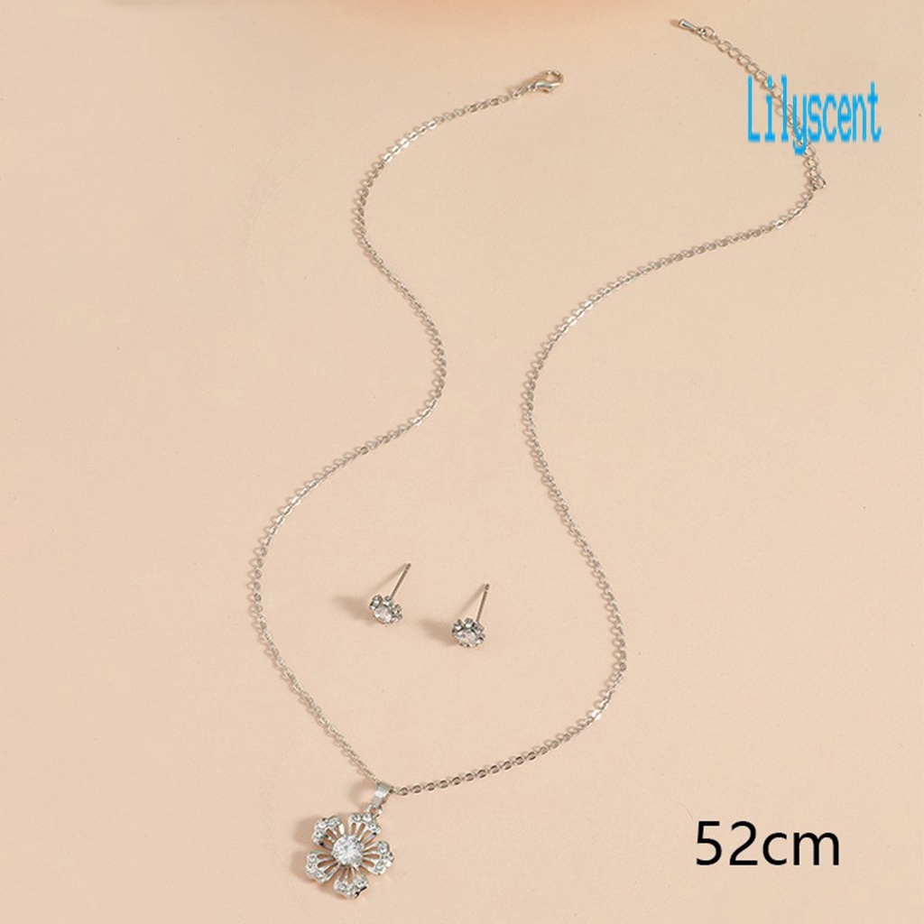 1 Set Kalung Dan Anting Bentuk Kepingan Salju Model Hollow Out Bahan Cubic Zirconia Untuk Wanita