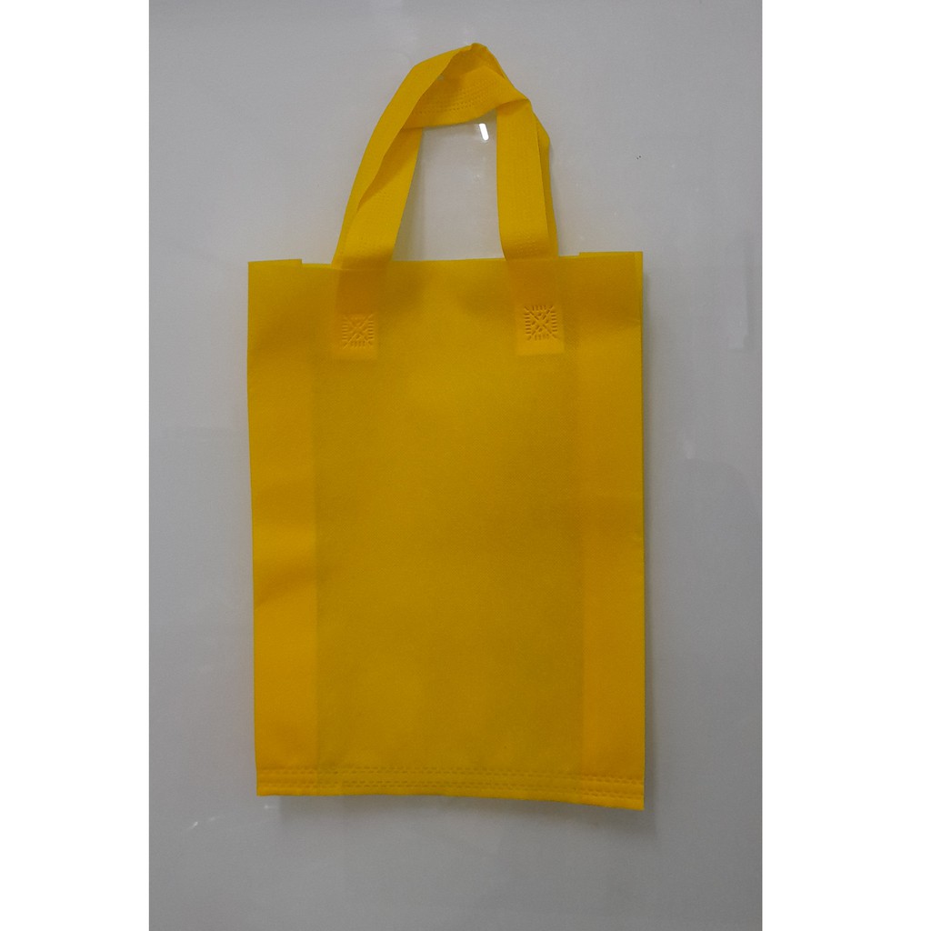 

Tas Press Spunbound Tali Goodie Bag Tas Belanja Warna Kuning 25 cm x 35 cm