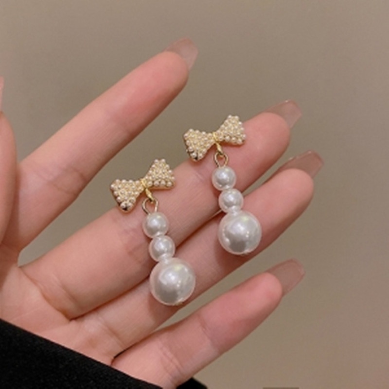 Anting S925 Silver Needle Bentuk Pita Aksen Mutiara Gaya Korea Untuk Wanita