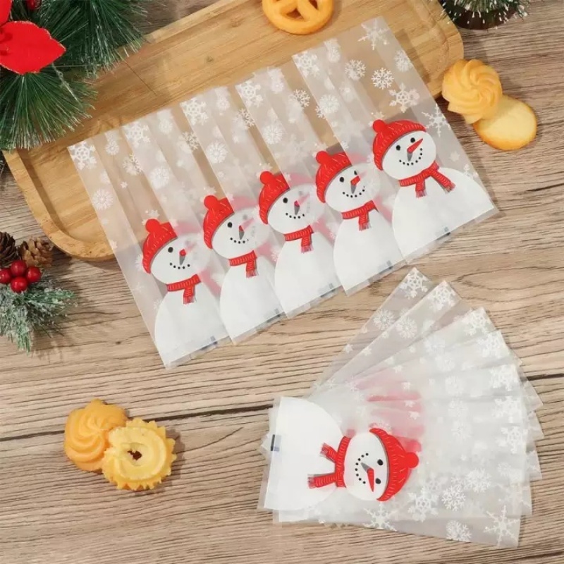 50pcs / Kantong Plastik Transparan Motif Kartun Santa Claus / Manusia Salju Untuk Tempat Permen / Snack / Kue