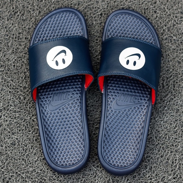 nike slides with smiley face