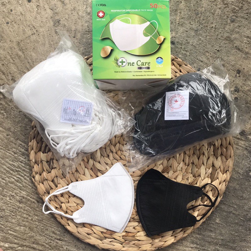 Duckbill One Care 1 box Isi 50pcs warna hitam dan putih ada garis tengah