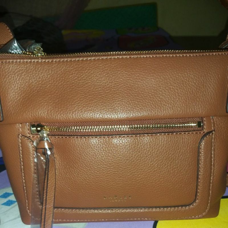 Tas radley London original warna brown..masih new..tapi tag label sudah lepas.