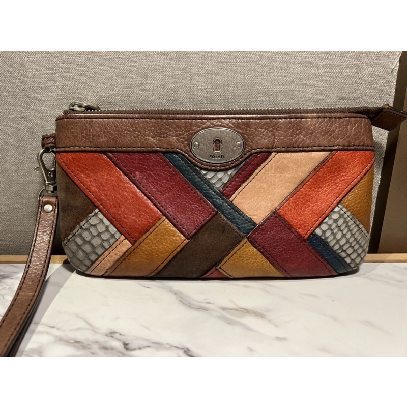 Fossil Maddox Clutch motif dark patchwork (Preloved)