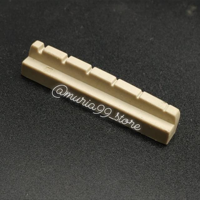 Nut gitar akustik  kidal kiri