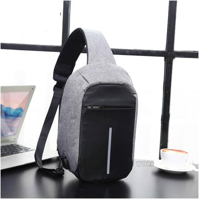 Tas slempang tas anti maling USB charger