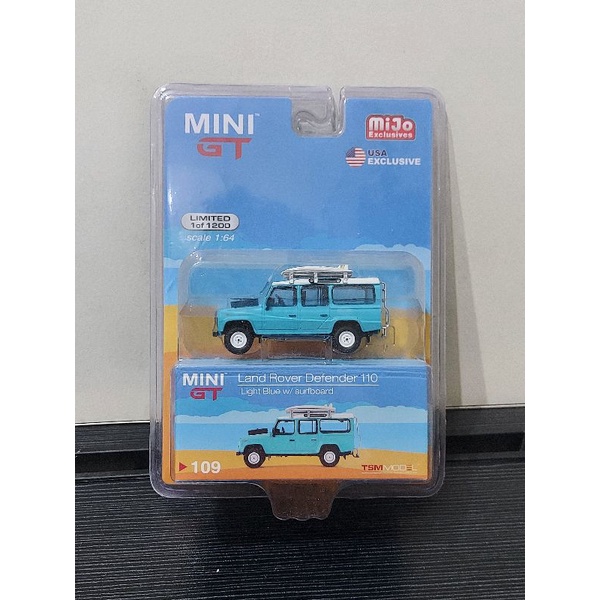 Mini GT 109 Land Rover Defender 110 LightBlue With Surfboard Blister