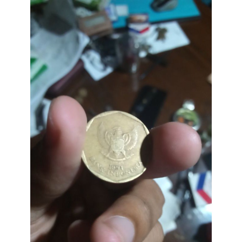 uang koin 100 rupiah karapan sapi