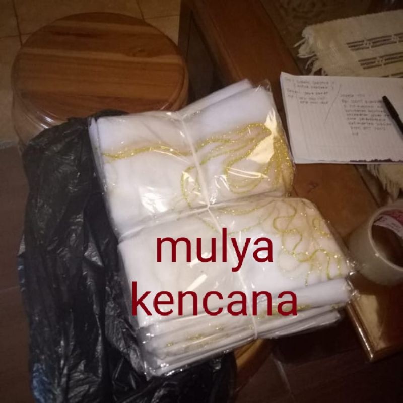 Kain tile penutup peti jenazah emas