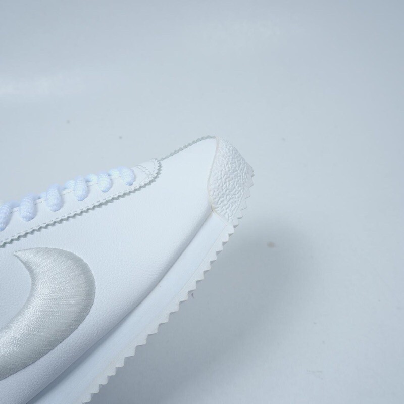 all white cortez womens