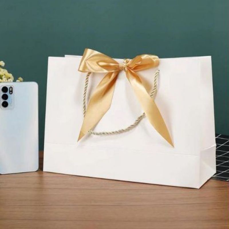 

HARGA GROSIR || PREMIUM PAPERBAG SOFT white " PEARL " GOLD RIBBON.22X10X22 cm.