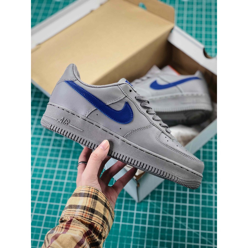 gray and blue nike shoes