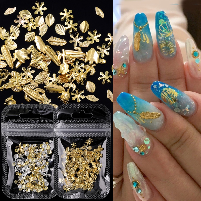 1 Kotak Aksesoris Dekorasi Nail Art DIY Bentuk Kerang / Bintang Laut / Daun Warna Emas / Silver Metalik