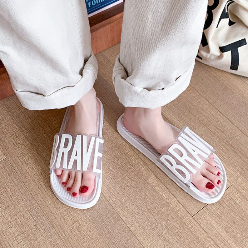 IDEALIFESHOES TOKO SANDAL WANITA IMPORT TERBARU MODEL SLIP ON BERTULISAN BRAVE  WARNA PINK DAN PUTIH BAHAN PVC KARET ANTI SLIP