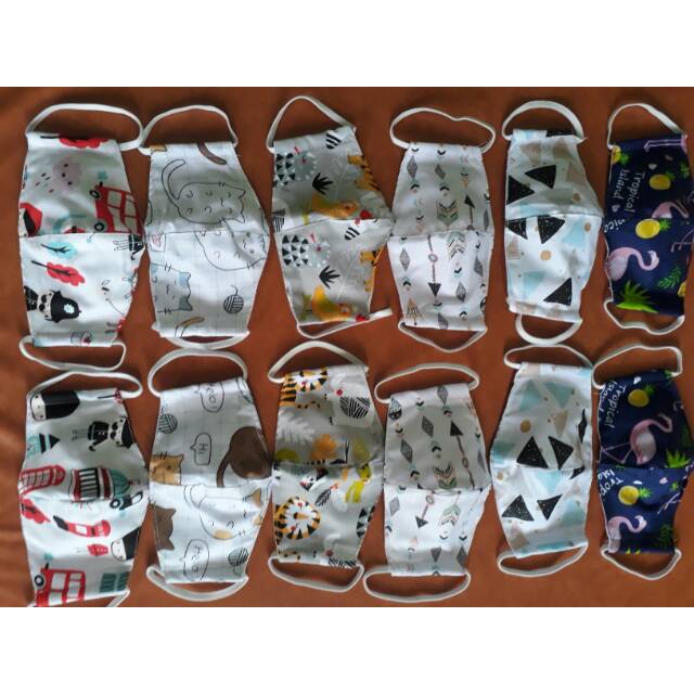 Masker kain anak dan balita.model karakter tali karet telinga..2 ply