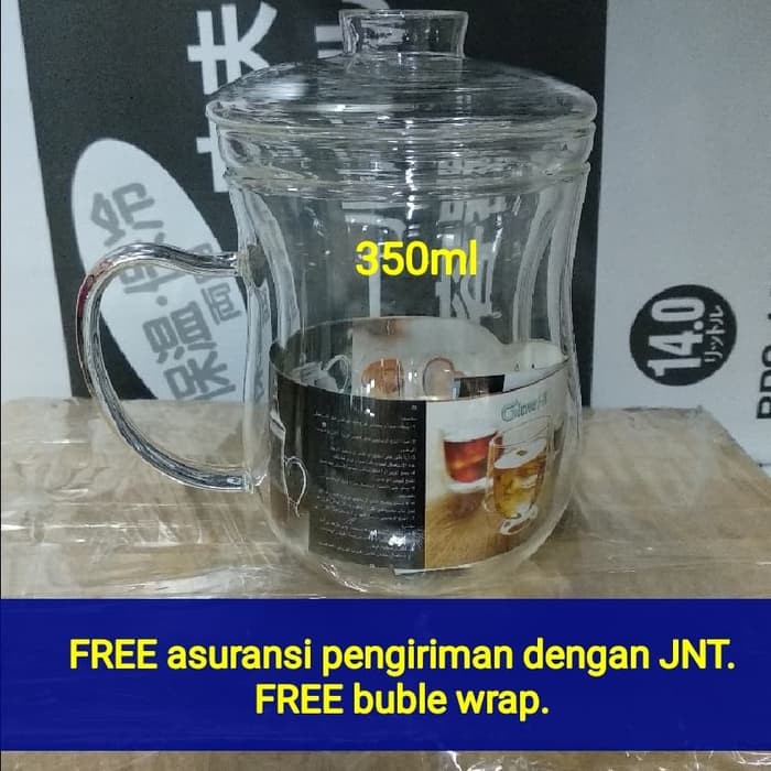 

Gelas teh kaca berikut saringan dan tutup. Tinggi 12cm lebar 8cm.