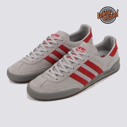 grey and red adidas trainers