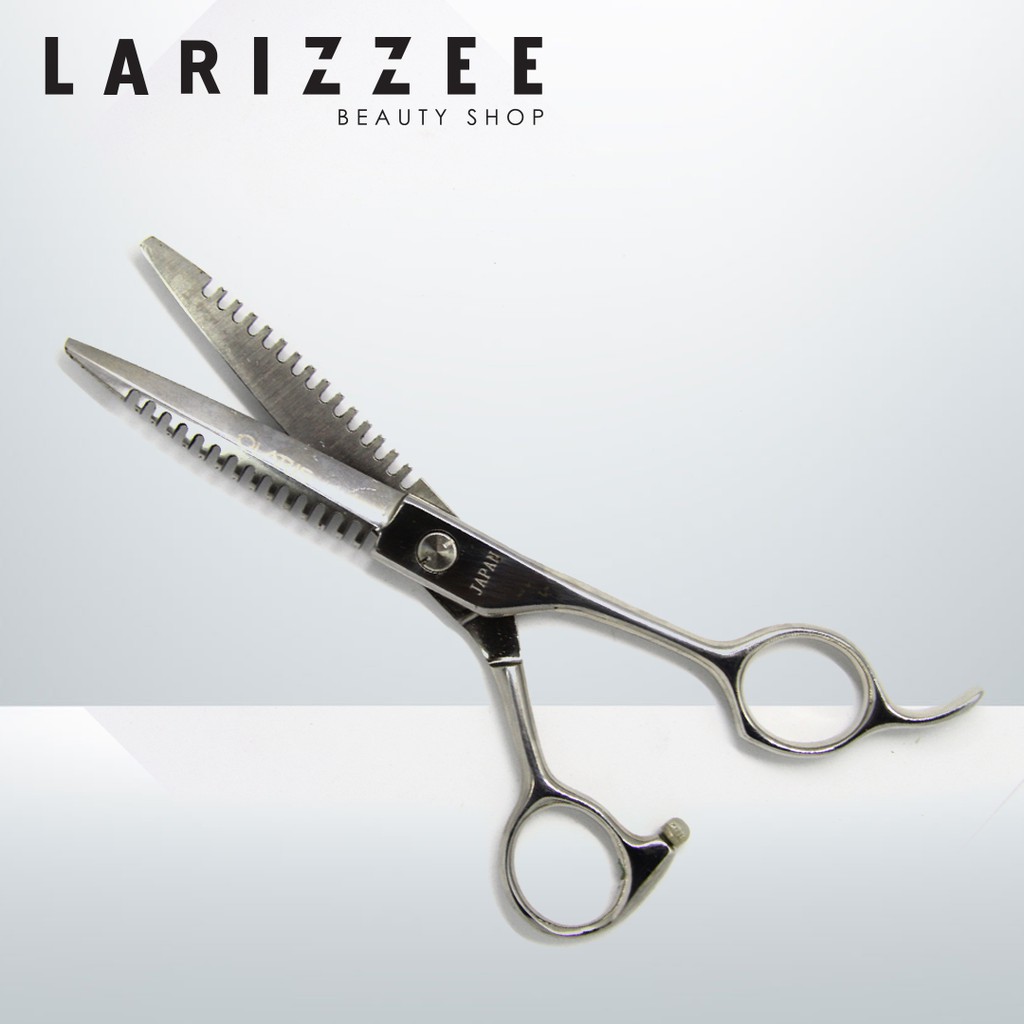 OLARIS GUNTING RAMBUT