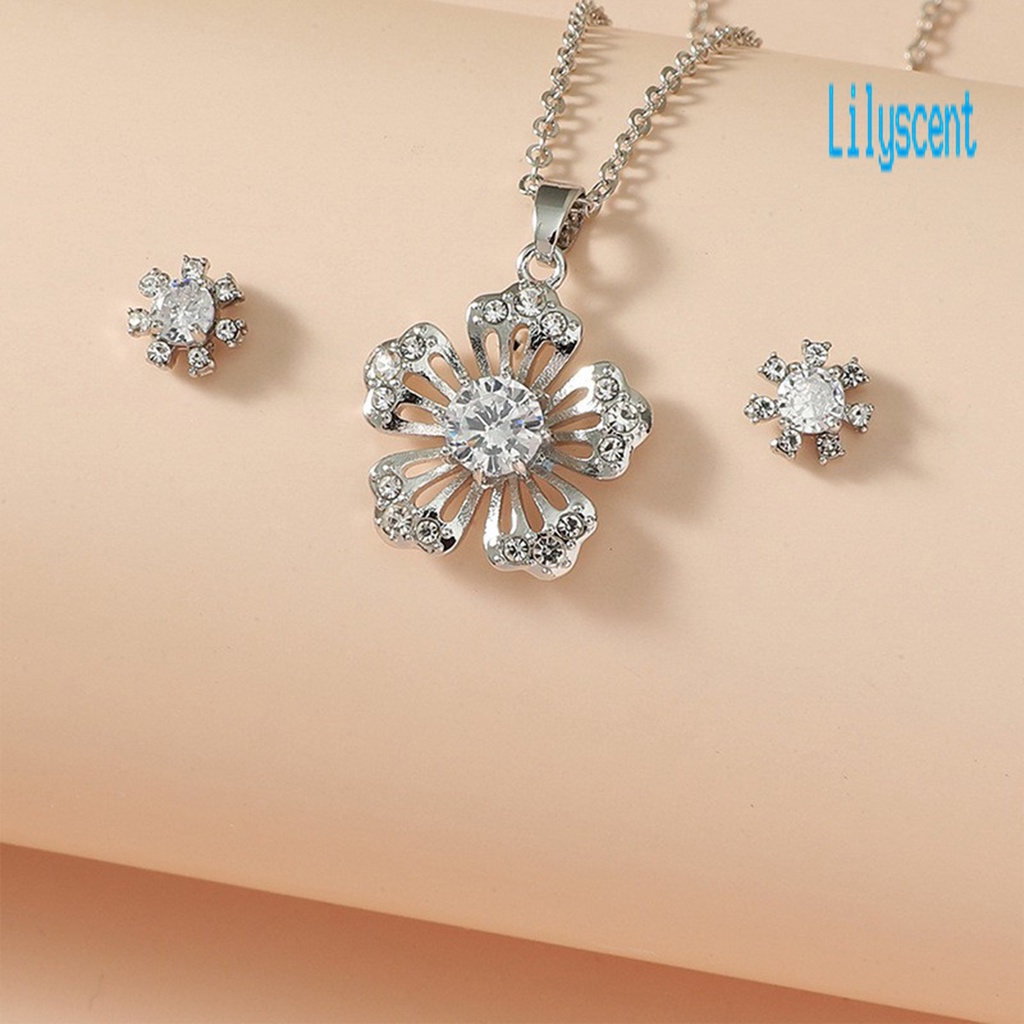 1 Set Kalung Dan Anting Bentuk Kepingan Salju Model Hollow Out Bahan Cubic Zirconia Untuk Wanita
