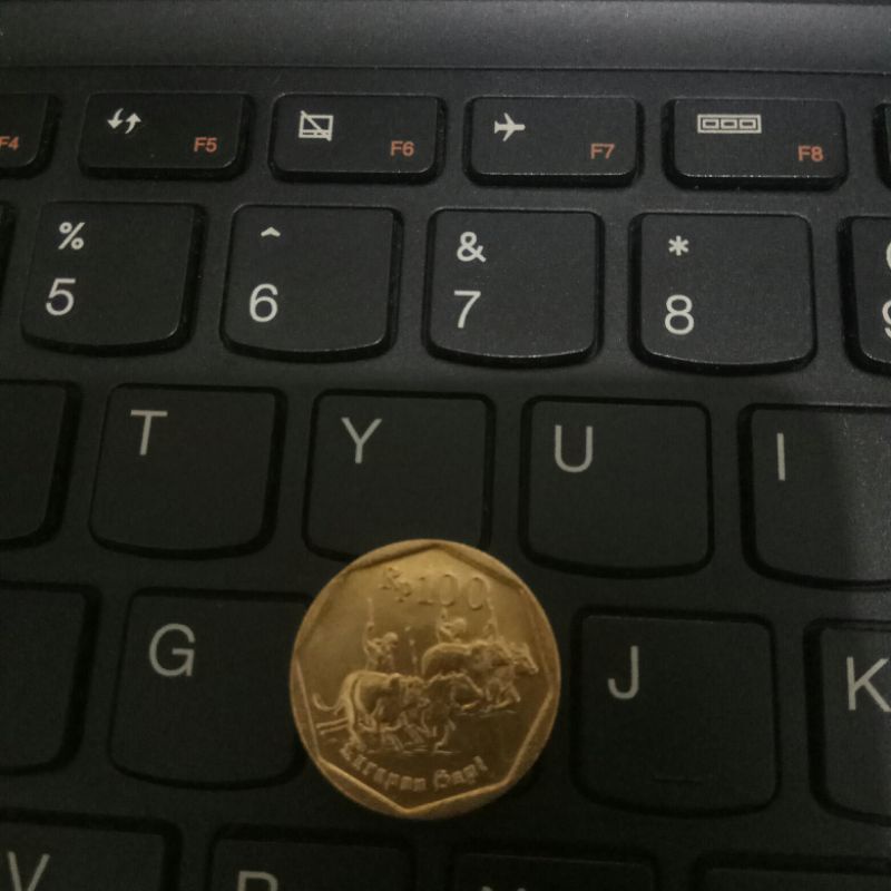 koin kuno 100 rupiah karapan sapi