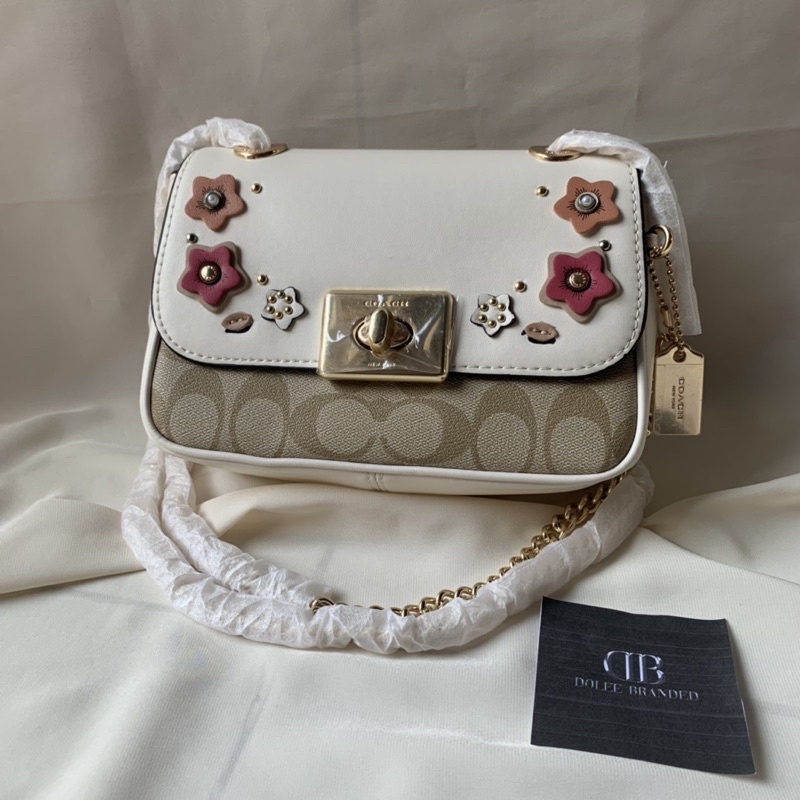 MINI CASSIDY CROSSBODY IN SIGNATURE CANVAS WITH FLORAL APPLIQUE  (COACH F73057)