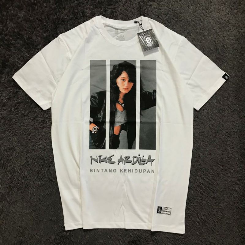 NIKE ARDILLA - BINTANG KEHIDUPAN ORIGINAL (KAOS, CD, TOTEBAG)