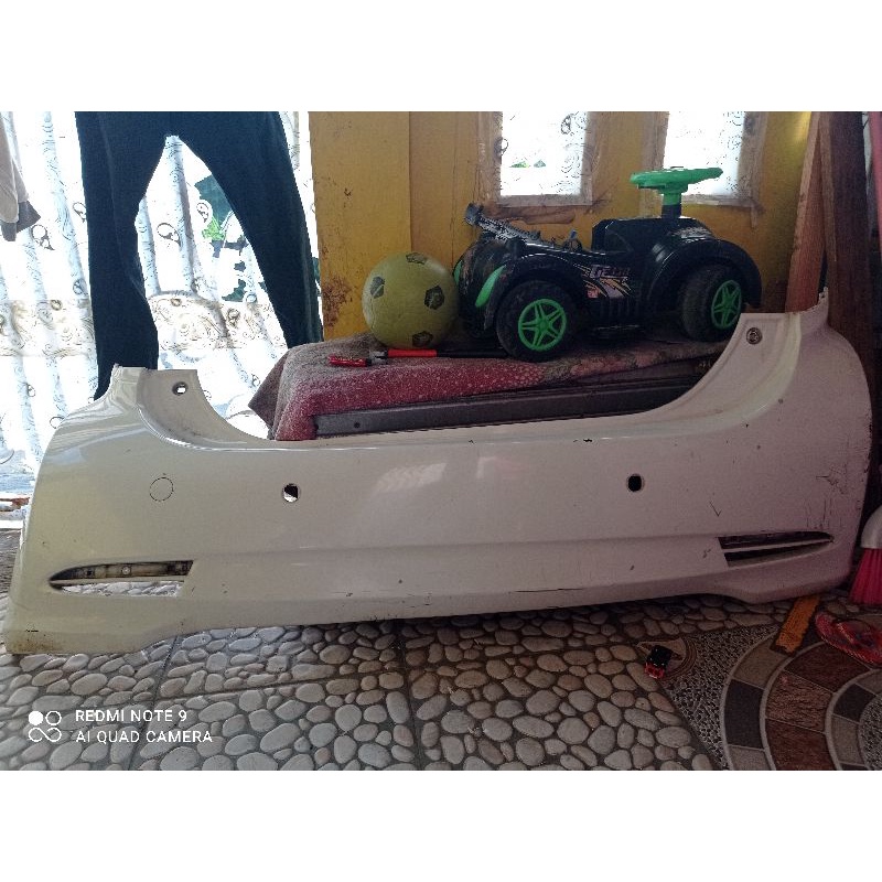 bumper belakang sirion 2013
